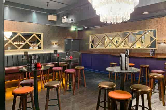 Modern venue interior with stylish seating for intimate meetings and social events.