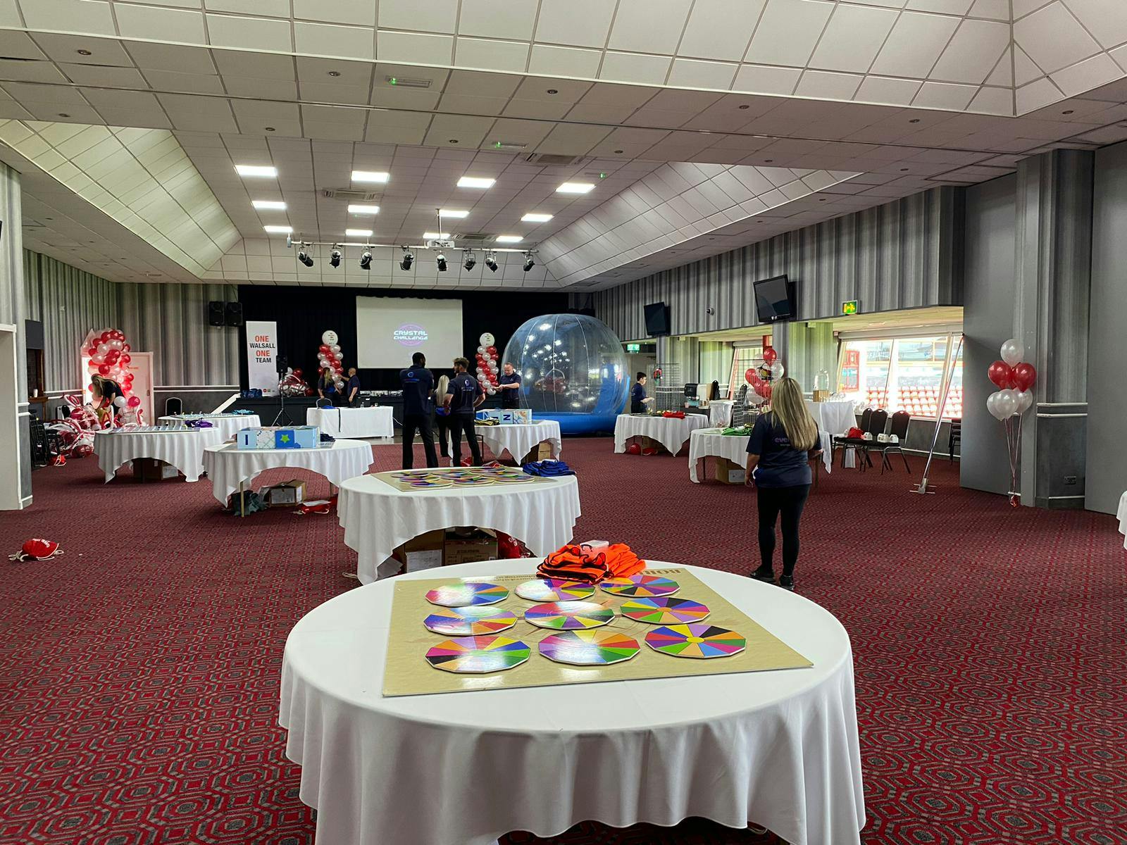 Spacious Walsall FC event venue with round tables for meetings and networking sessions.