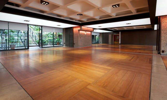 The Garden Room at Barbican Centre: modern event space with polished wooden floor.