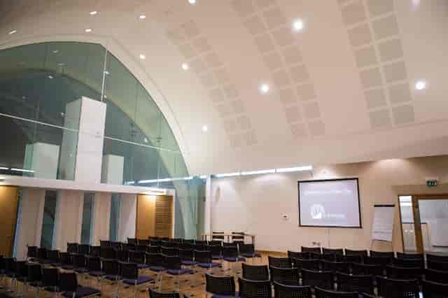 Modern event space at St Barnabas Church with tiered seating for corporate workshops.
