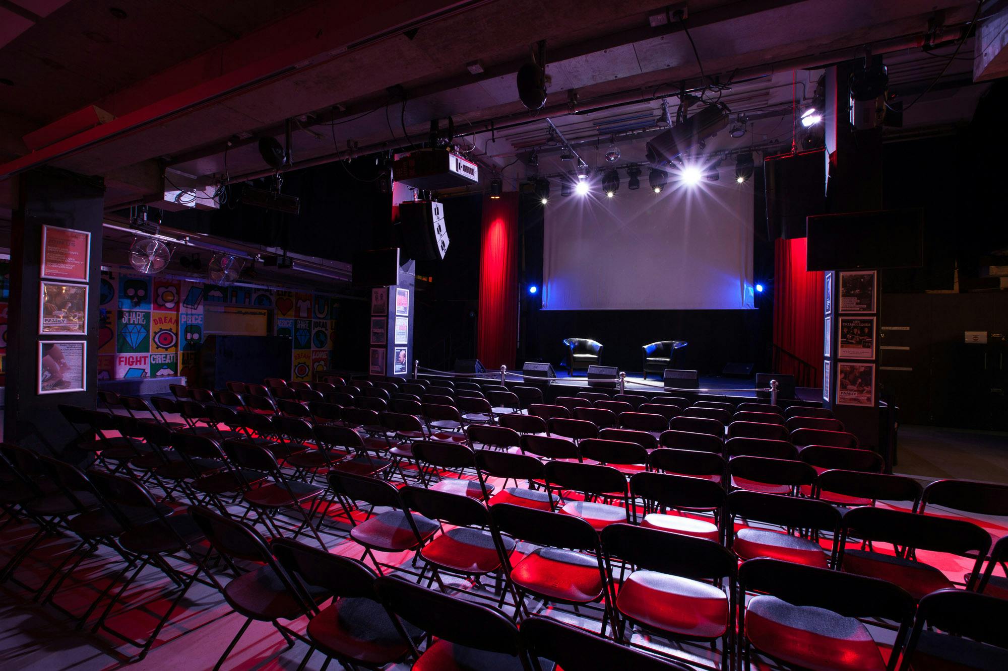 Event space at Rich Mix with stage, lighting, and ready seating for presentations.