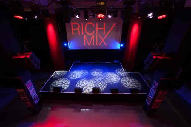Well-lit stage at Rich Mix venue, ideal for performances and events with dynamic lighting.