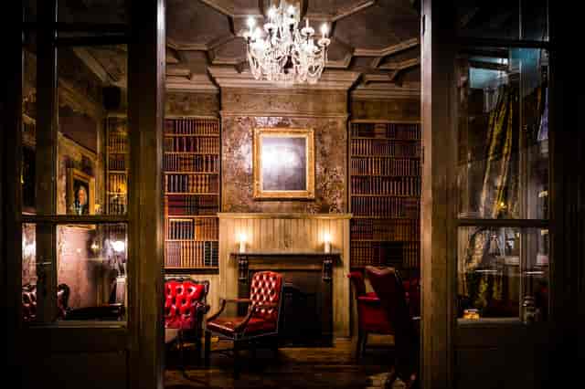 Elegant meeting space with plush red seating, ideal for networking events and conferences.