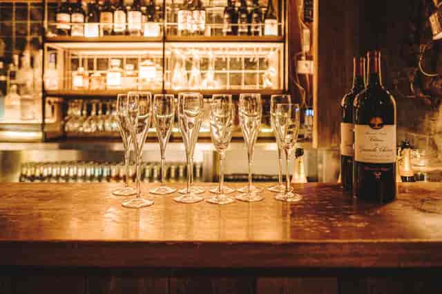 Elegant bar setup with champagne flutes for a celebratory event in Kensal Green.