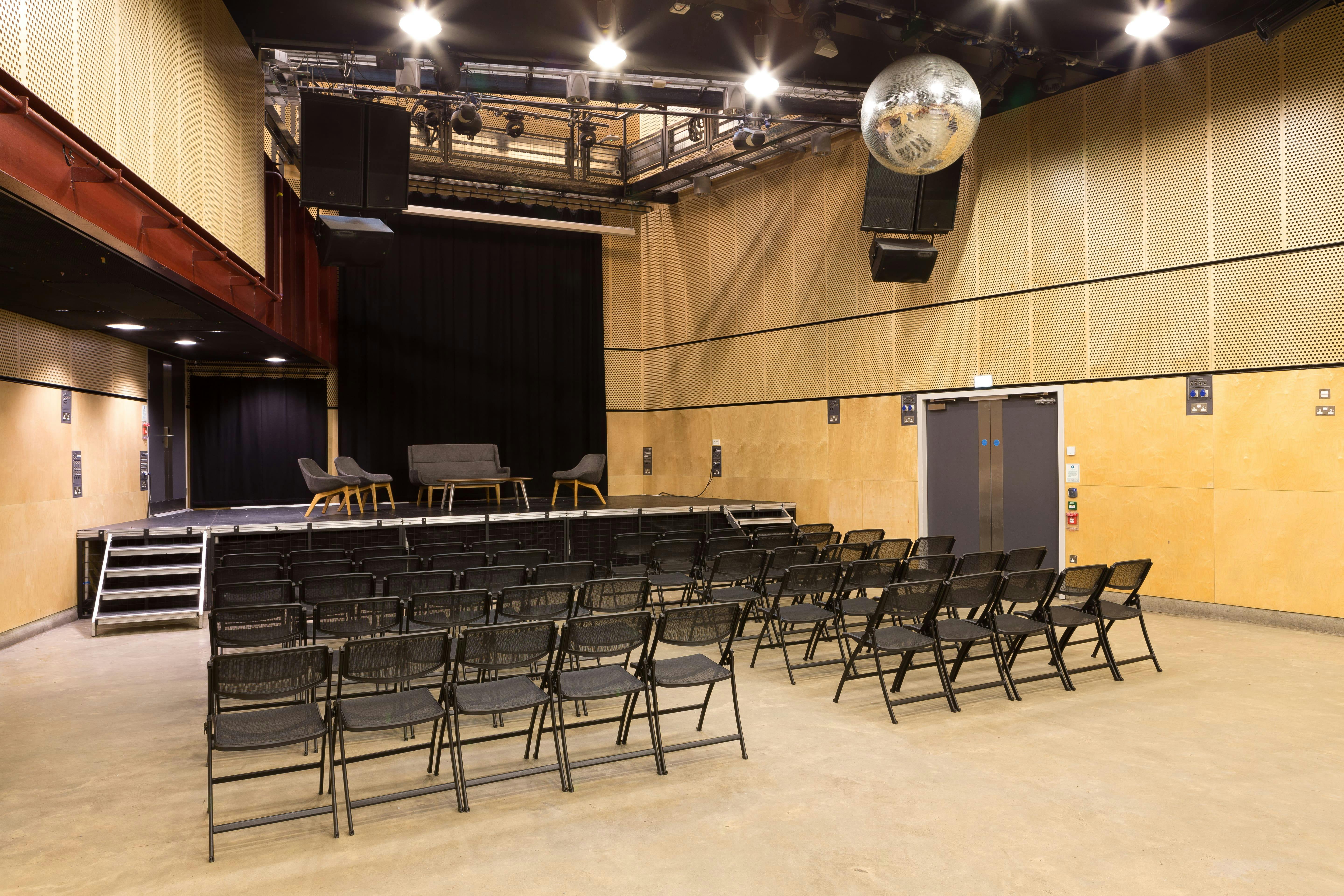 Main Venue at Saw Swee Hock Centre, featuring seating for presentations and a disco ball.