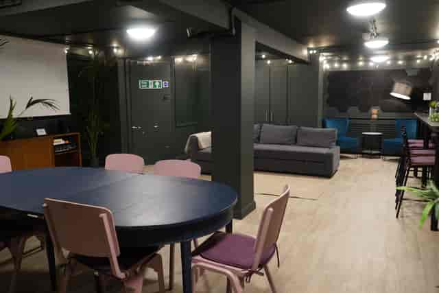 Versatile event space at Young Actors Theatre Islington with round table setup for meetings.