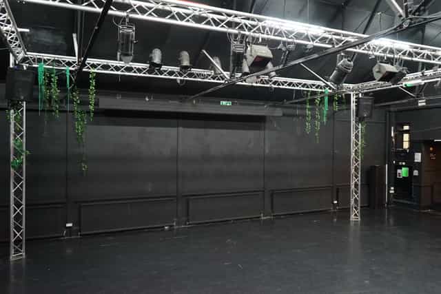 Versatile event space with black backdrop and lighting at Young Actors Theatre Islington.