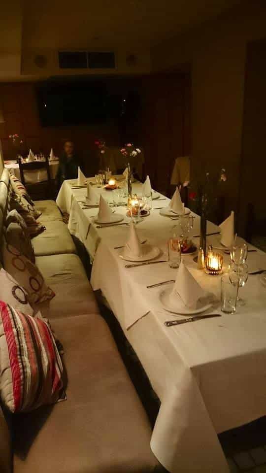 Elegant dining table in Retsina Private Room for formal dinners and intimate gatherings.