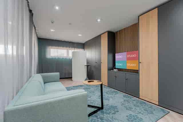 Modern meeting space in FACT Liverpool with flexible furniture for events and presentations.