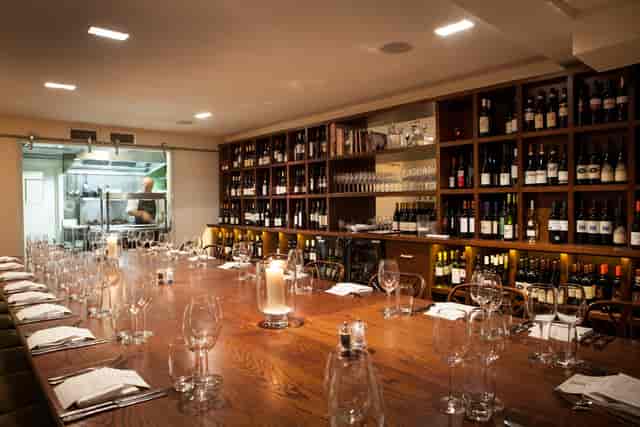 Private dining room with wine storage for intimate board dinners or luxury events.