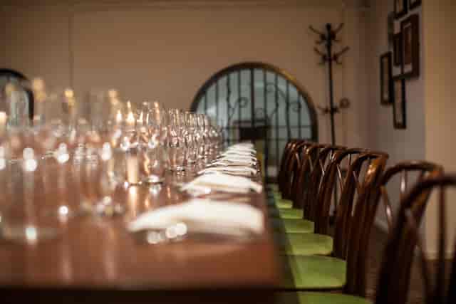 Private boardroom table setup in Vinoteca Marylebone for an exclusive executive dining event.
