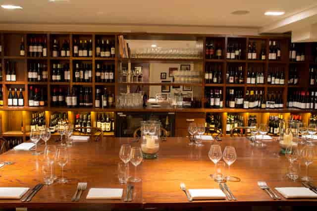 Private dining room at Vinoteca Marylebone with rustic table for VIP events and board dinners.