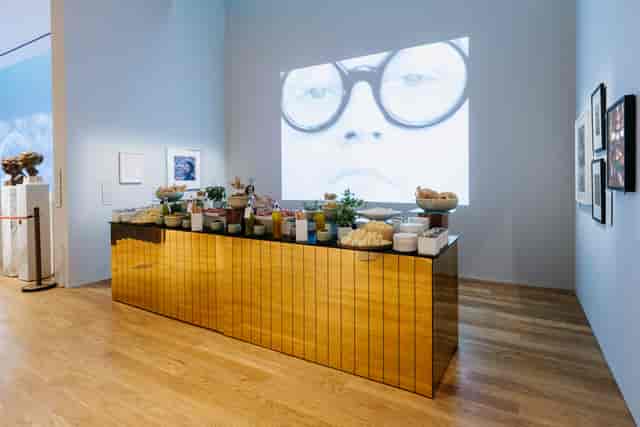Elegant buffet setup with reflective gold surface at National Portrait Gallery event.