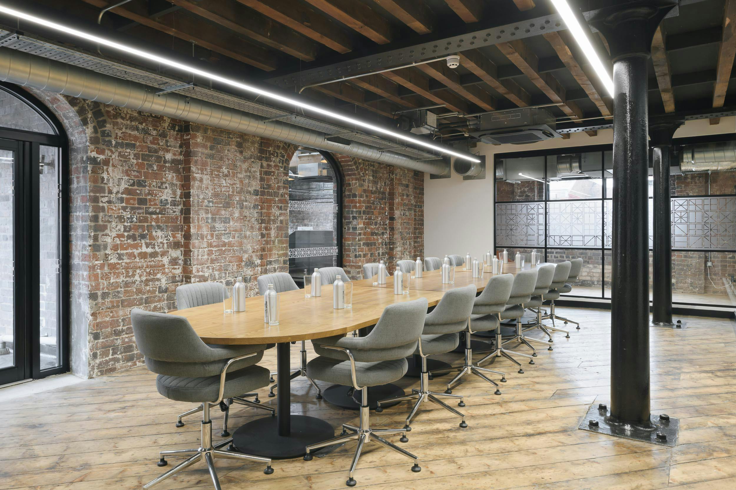 Modern Grand Union Boardroom with oval table, ideal for workshops and meetings.