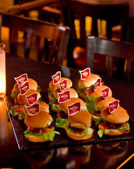 Mini burgers platter with branded flags at Hard Rock Manchester networking event. - Banner