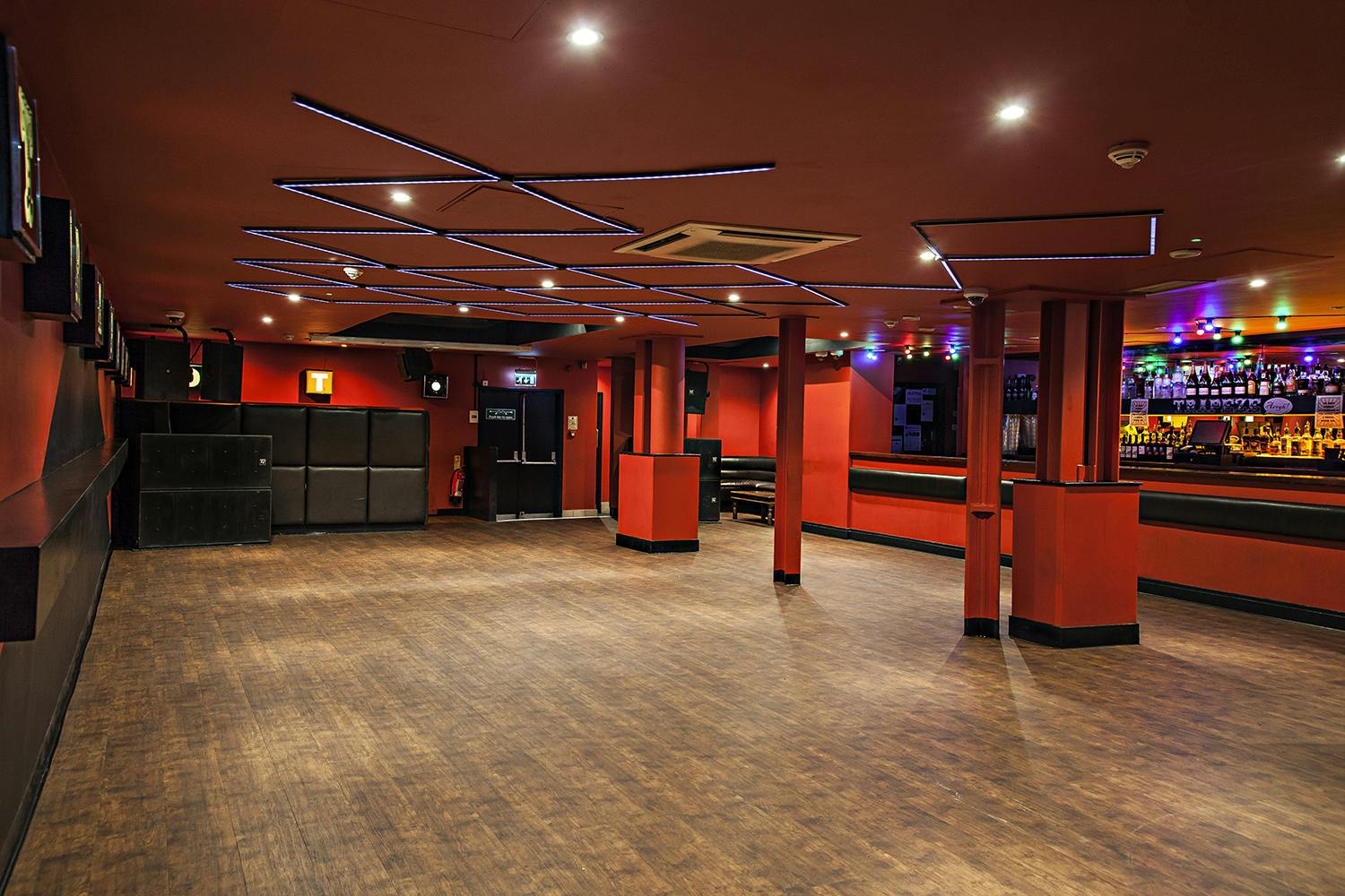 Modern event space at The Basement Club with vibrant lighting for parties and presentations.
