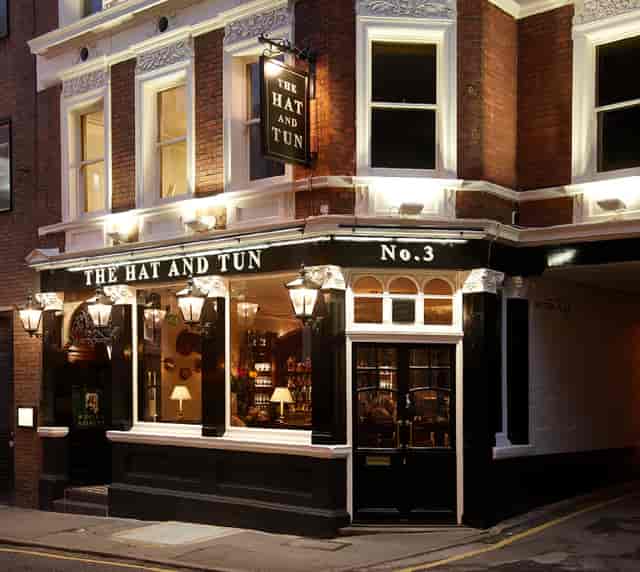 Charming venue The Hat & Tun with warm lighting, ideal for intimate events and meetings.