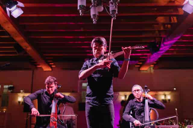 Live performance at New Armouries, Tower of London, featuring string musicians for events.