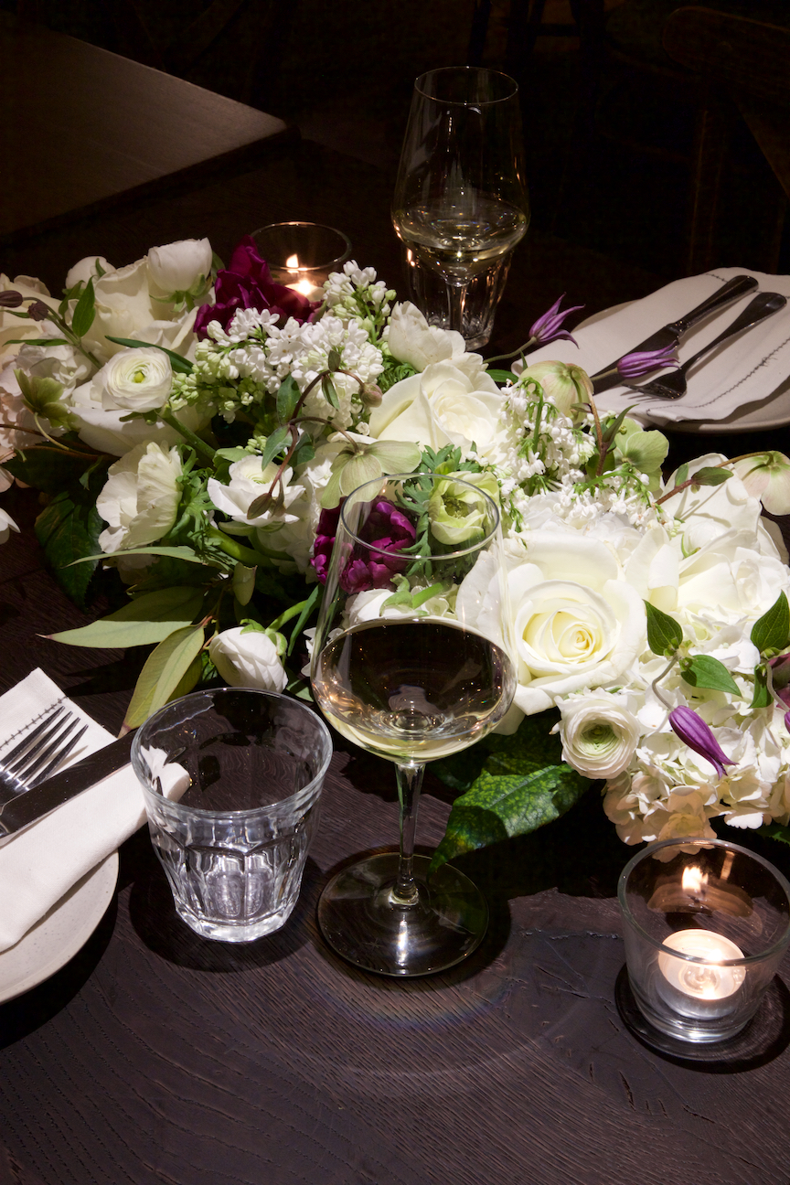 Elegant table with floral centerpiece at Brasserie Blanc Southbank for upscale events. - Banner