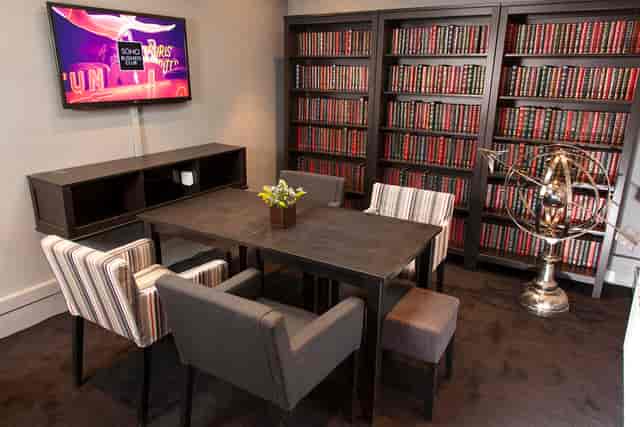 Clubhouse library breakout room for professional strategic planning and small group meetings.