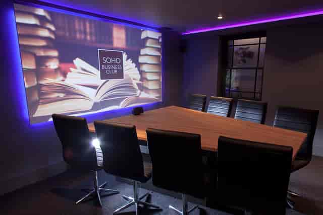 High-end boardroom at Club 16 with mood lighting for strategy sessions and client presentations.