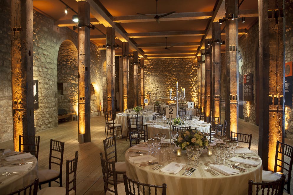 Elegant White Tower event space with round tables, perfect for weddings and corporate events.