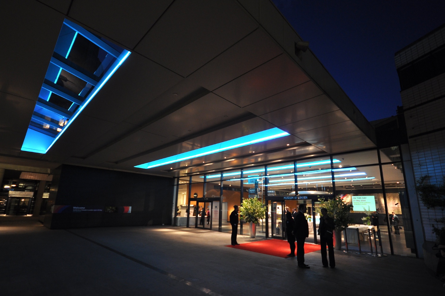 Modern venue entrance with blue lighting, ideal for networking events in London. - Banner