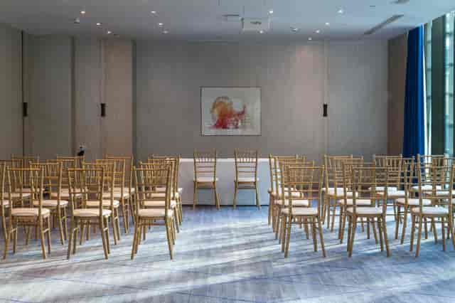 Event space at Hilton London Tower Bridge with gold chiavari chairs for meetings and workshops.