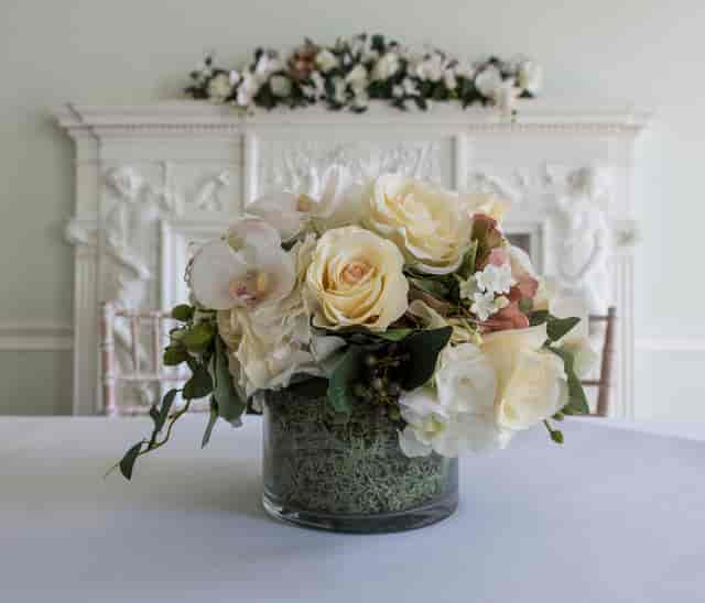 Elegant floral arrangement in Fine Room 1, perfect for weddings and upscale events.