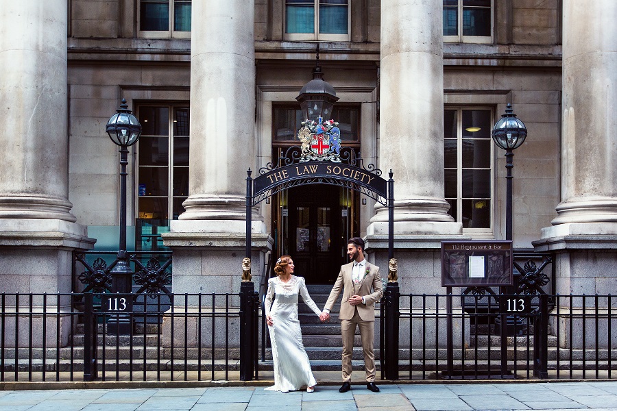Couple in front of elegant Law Society venue, ideal for upscale weddings and events. - Banner