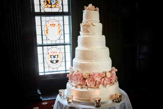 Elegant multi-tiered wedding cake with floral accents at The Common Room, 113 Chancery Lane.