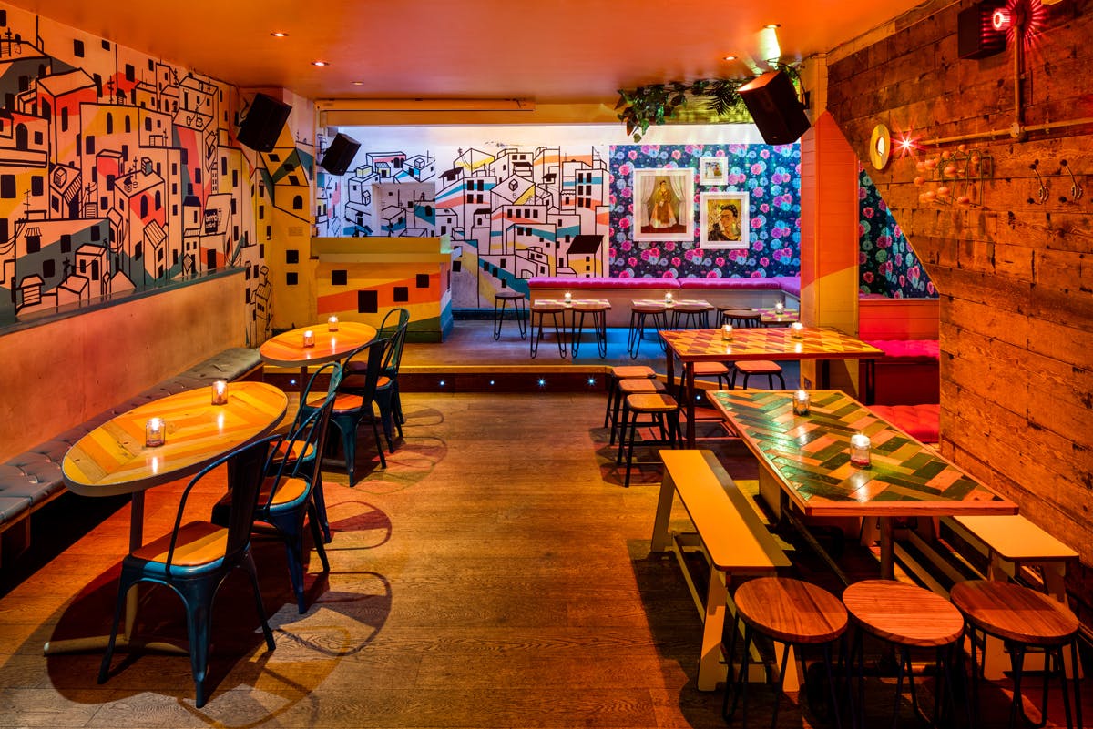 Vibrant event space in Barrio Soho with colorful murals for creative gatherings.