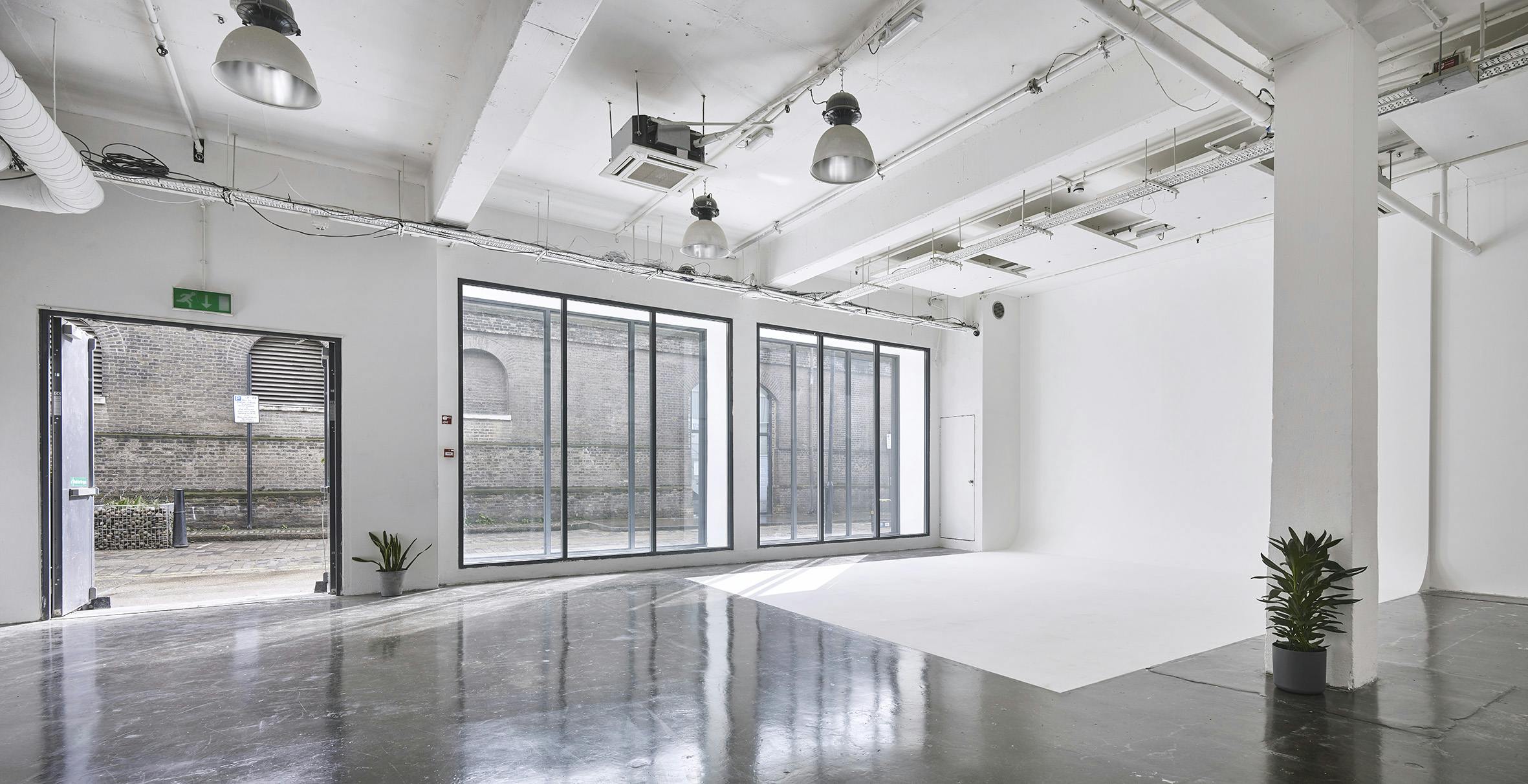 Versatile event space with natural light, ideal for workshops and networking events.