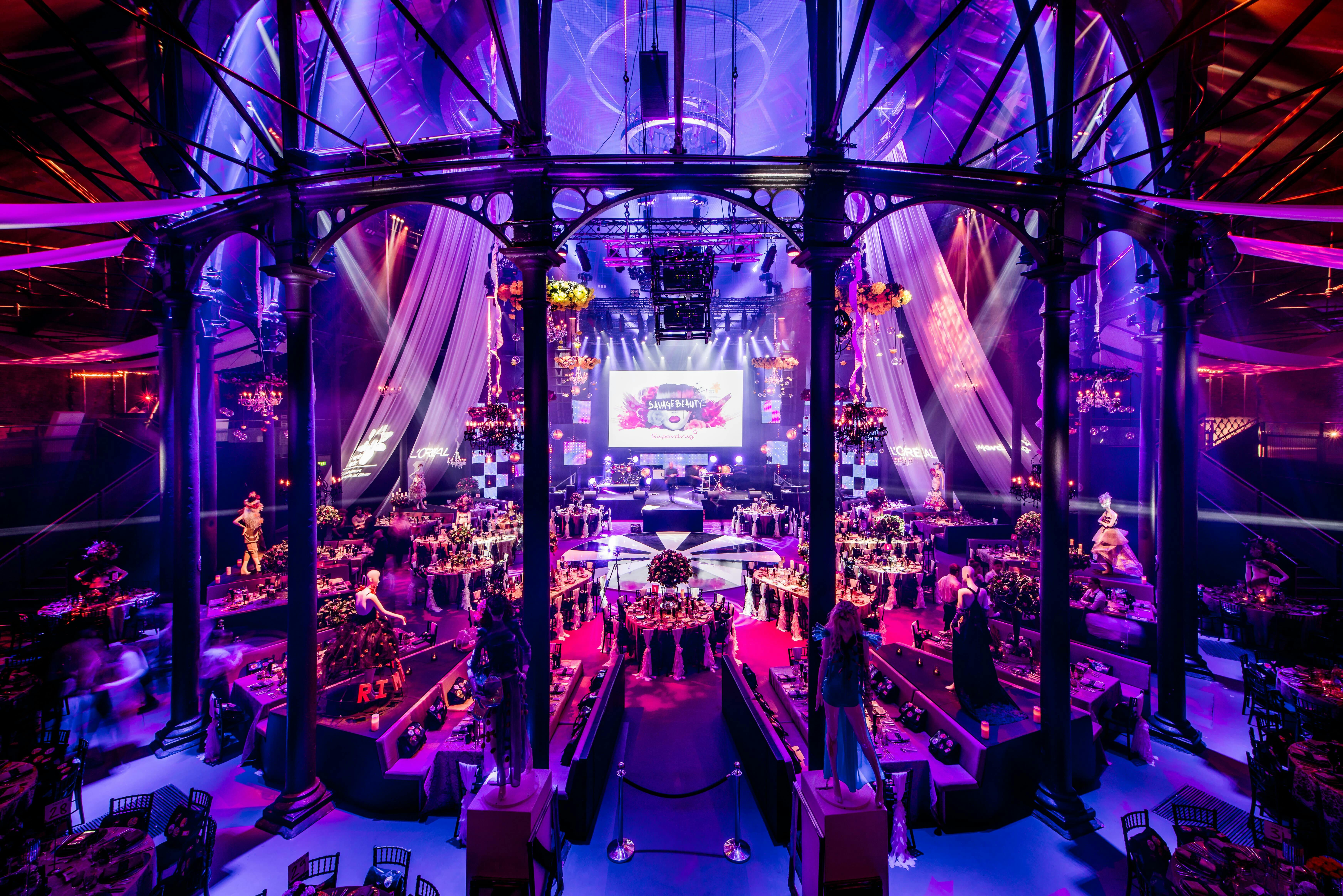 Elegant event space in Roundhouse with purple lighting for upscale gala or corporate celebration.