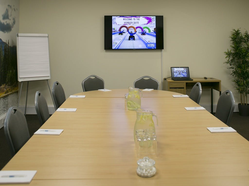 Vail Suite meeting room with long table, ready for professional event and collaboration.