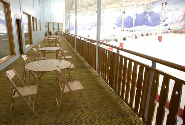 Après Lodge balcony overlooking indoor ice rink, perfect for networking events.