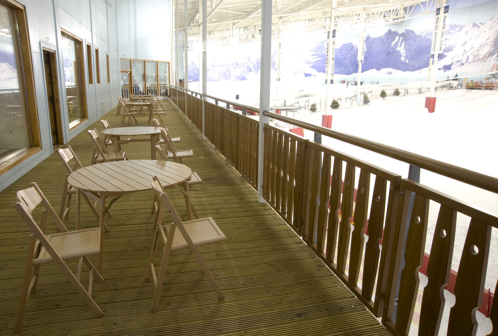 Après Lodge balcony overlooking indoor ice rink, ideal for networking events and gatherings.
