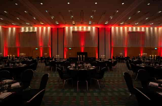 Deansgate Suite at Hilton: elegant dinner setup with black linens and warm lighting.