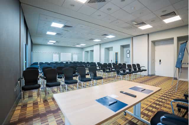 Meeting Room at Hilton Deansgate, organized layout for efficient corporate events.