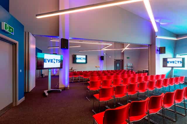 WaterShard 2 event space with red chairs, ideal for corporate meetings and presentations.