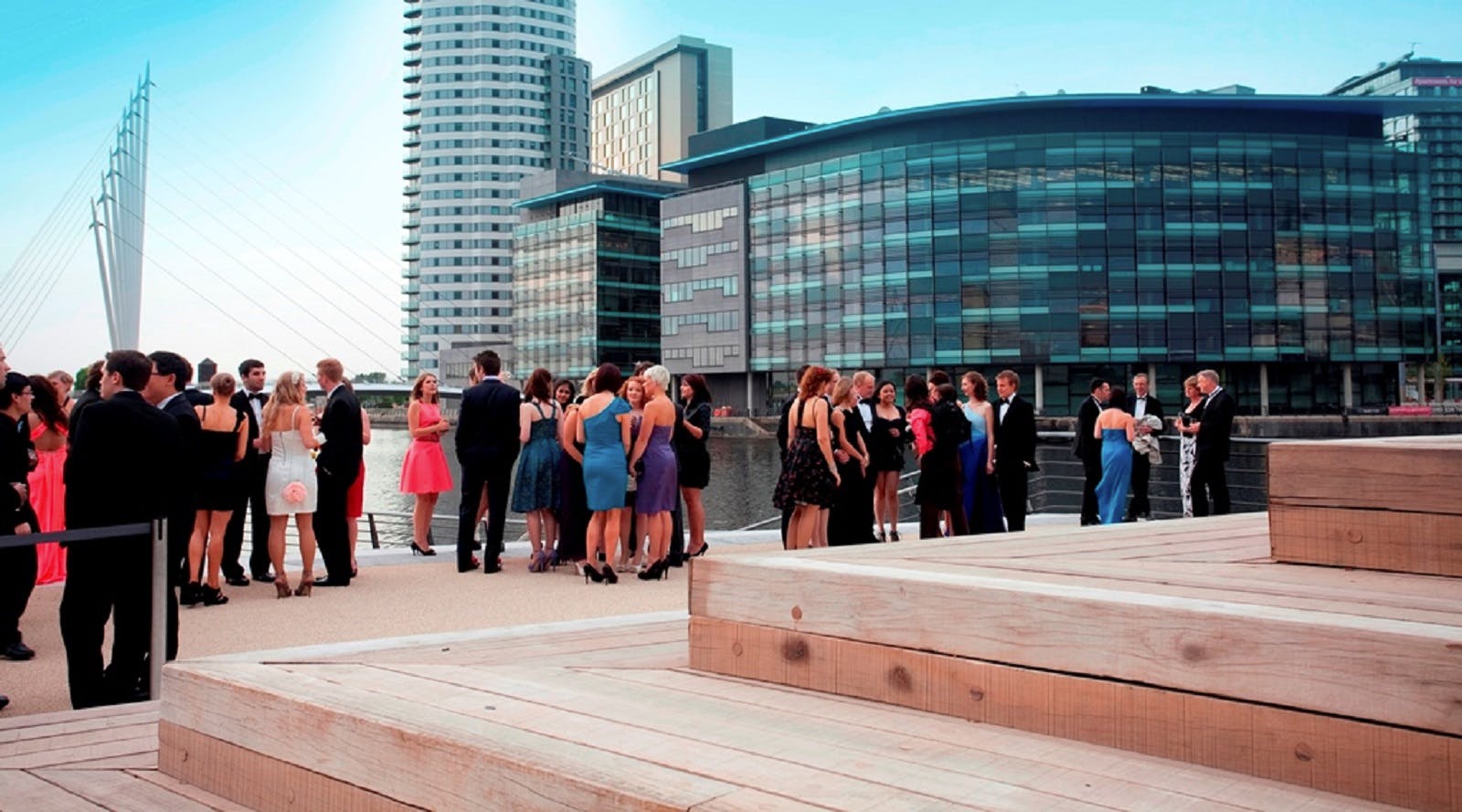 Elegant cocktail reception at Quayside, Imperial War Museum North, with modern architecture.