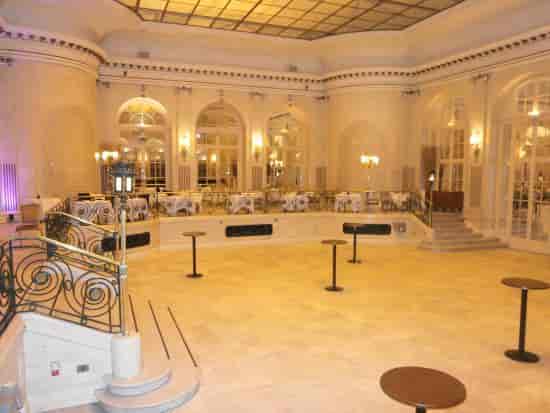 Elegant Palm Court venue at The Waldorf Hilton, ideal for corporate events and receptions.