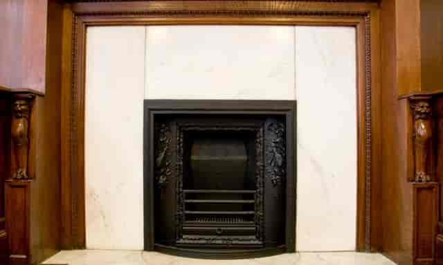 Council Chamber fireplace with marble surround, ideal for upscale events and meetings.