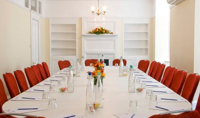 Euston Suite meeting room with elegant floral centerpieces for professional events.