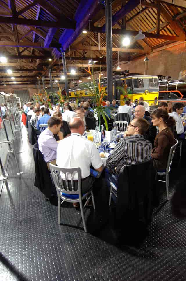 Power Hall event setup with vintage trains, greenery for networking and engagement.