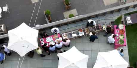 Outdoor event setup at The Bermondsey Square Hotel with vibrant food stations.
