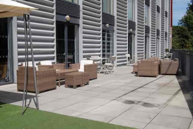 Outdoor networking space at The Bermondsey Square Hotel with modern seating.