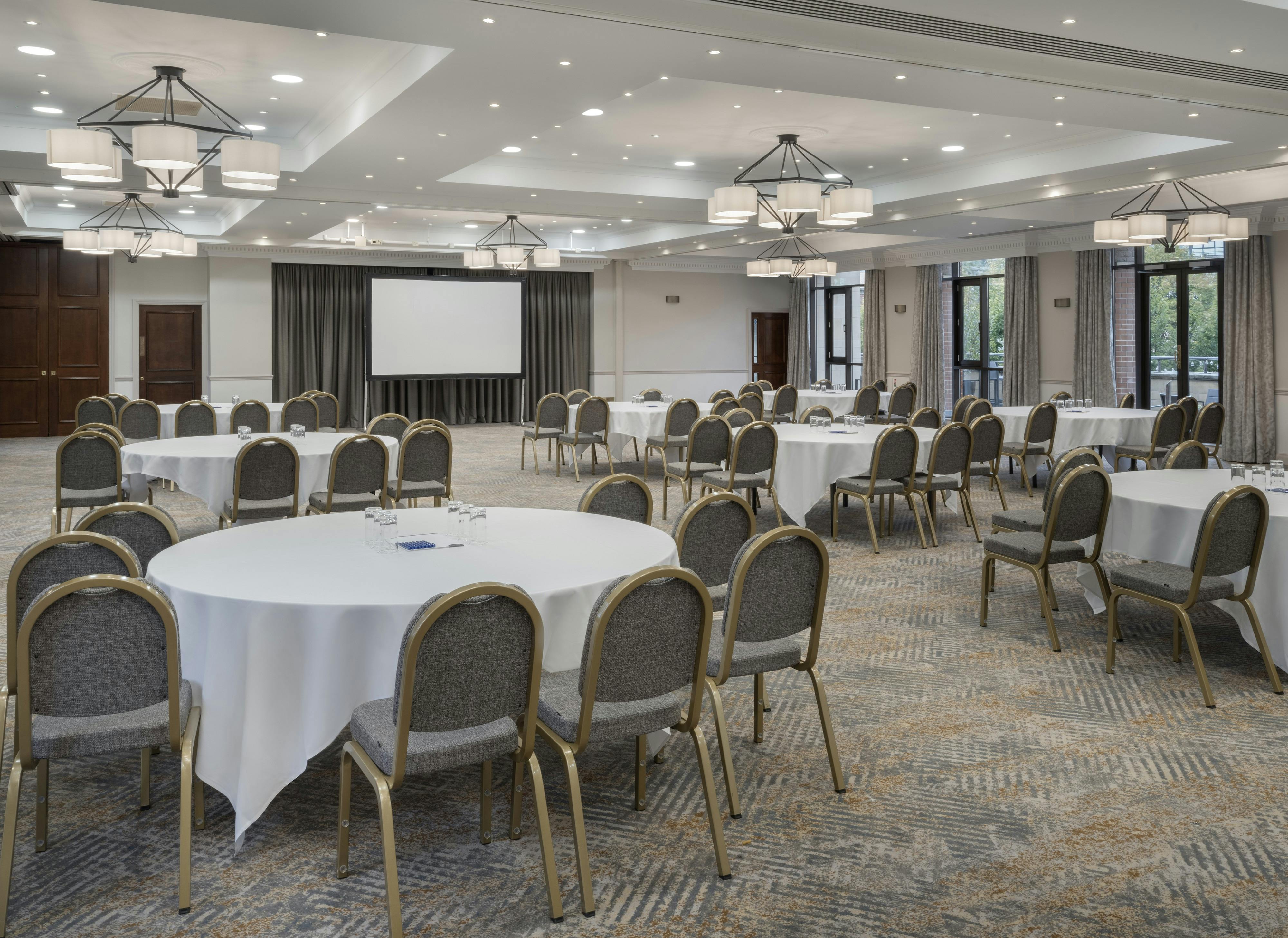 Merchant Suite at Delta Hotels Liverpool, ideal for meetings and banquets with round tables.