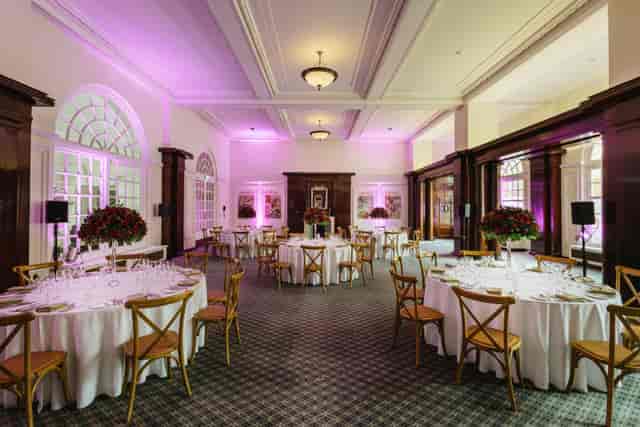 Elegant Paget Room at BMA House, ideal for weddings and corporate events with floral decor.