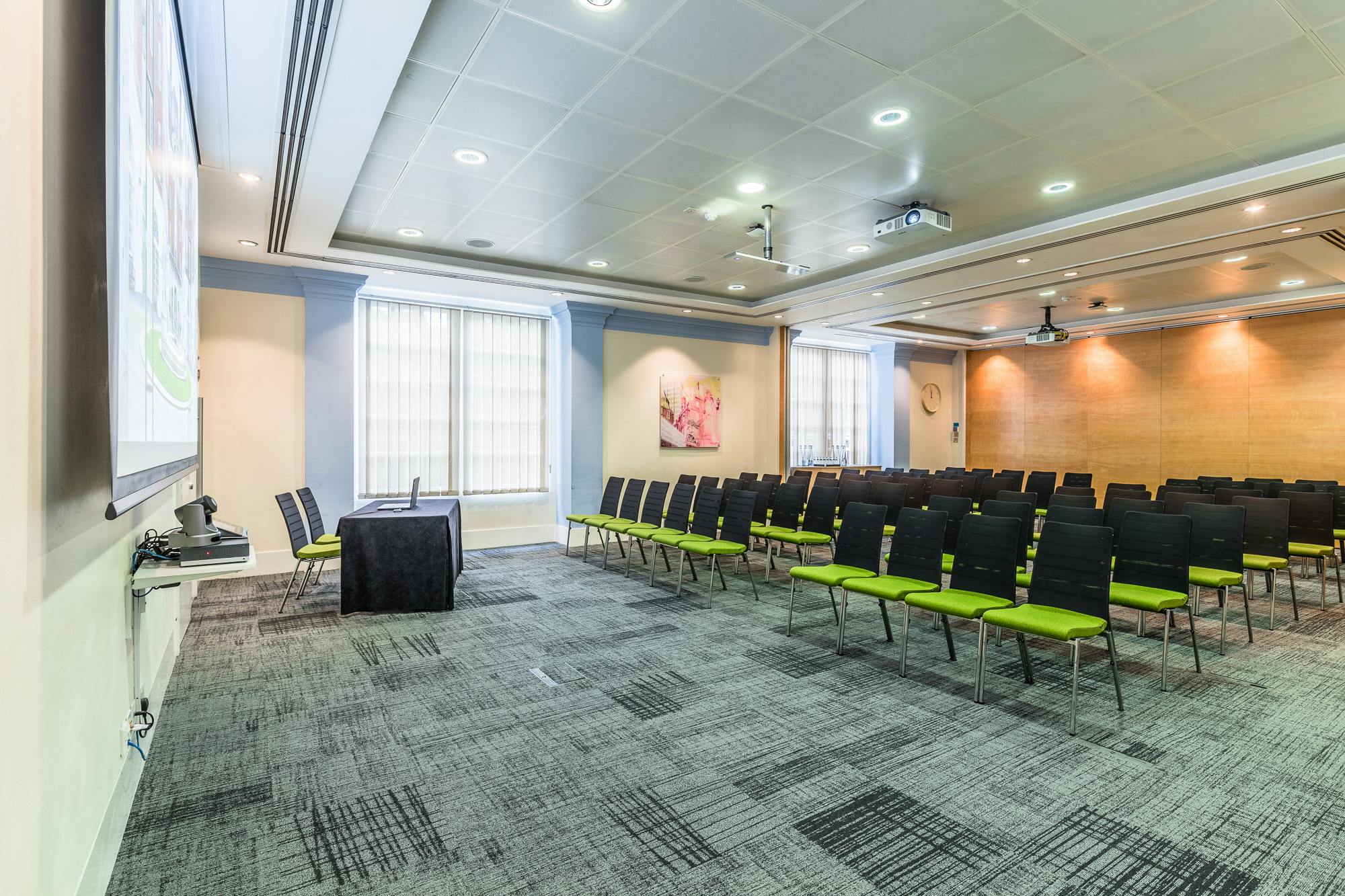 Murrell Room in BMA House: modern meeting space with projector for corporate events.